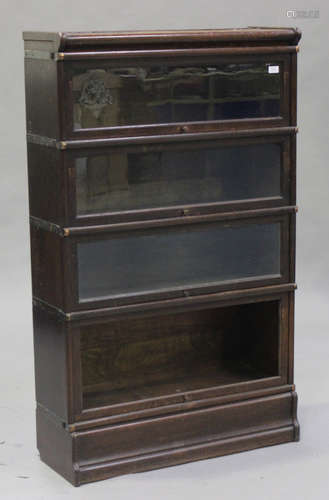 A George V oak four-section Globe Wernicke bookcase, height 142cm, width 87cm, depth 31cm (lacking