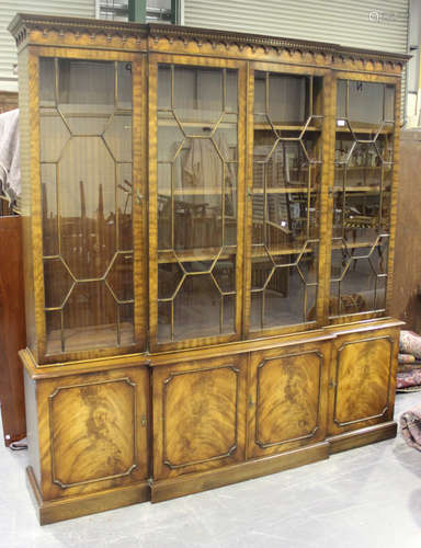 A late 20th century reproduction mahogany bookcase cabinet by Bevan Funnel, the dentil moulded