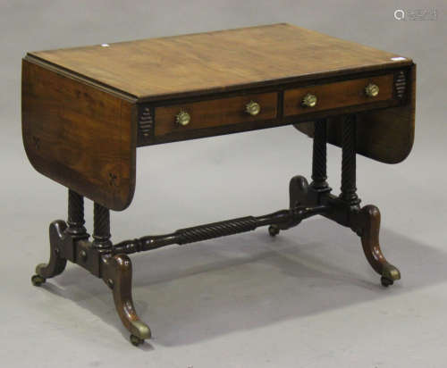 A Regency mahogany sofa table in the manner of Gillows, fitted with two frieze drawers, raised on