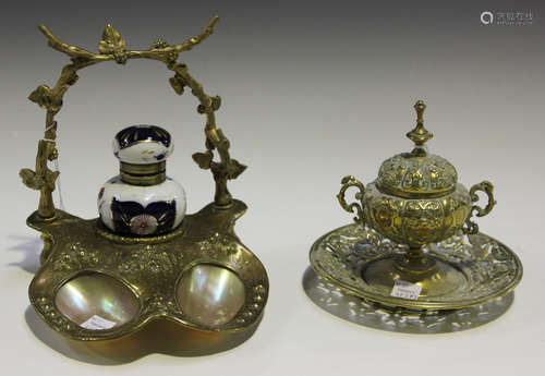 A Victorian brass and mother-of-pearl inset inkstand, fitted with a porcelain well, width 16cm,