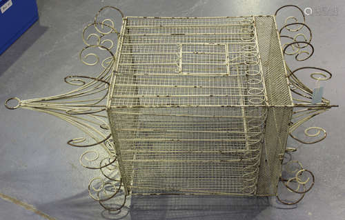 A 20th century white painted wrought metal hanging bird cage with scrolling supports, height