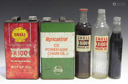 Two Shell X-100 motor oil glass bottles, one unopened, height 35cm, a Solvol bottle and two oil