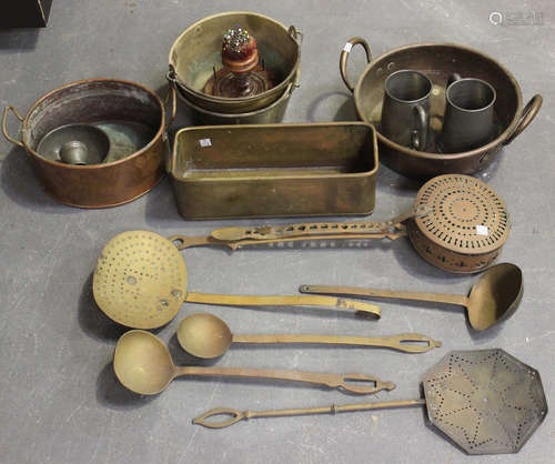 A collection of mainly 19th century copper and brassware, including a copper preserve pan, two brass