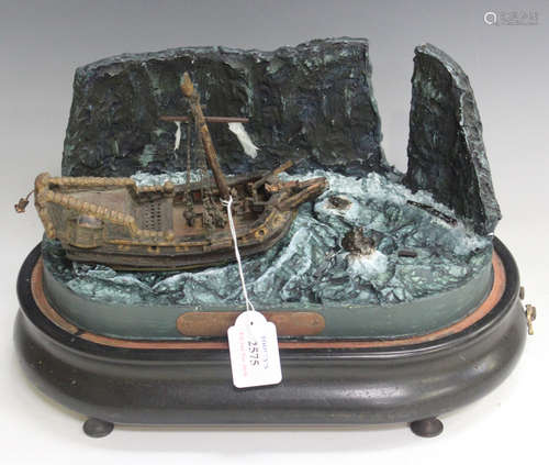 A late 19th century Swiss musical diorama of a shipwreck, the ebonized base containing a pull-wind