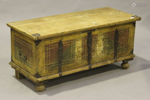 An early 20th century Continental pine trunk with painted and iron strapwork decoration, the