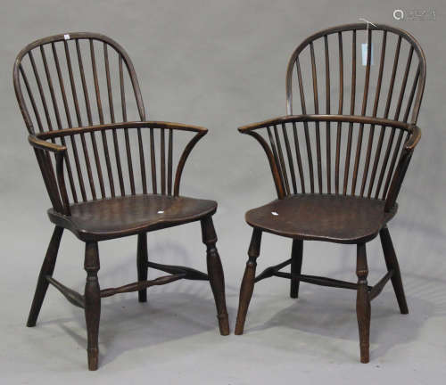 Two similar 19th century beech, ash and elm spindle back Windsor armchairs, the shaped seats on