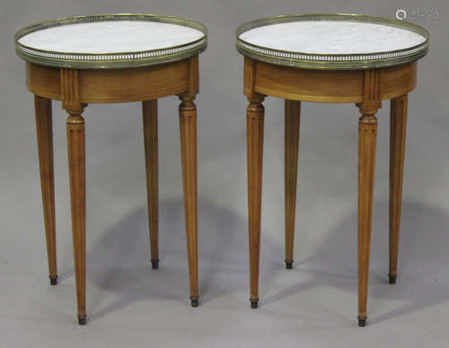 A pair of 20th century French walnut and white marble circular occasional tables with gilt metal