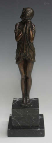 A late 20th century brown patinated cast bronze figure of an Art Deco style lady, raised on a