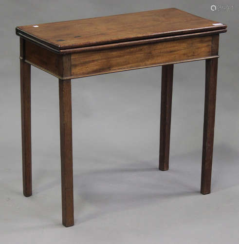 A small George III mahogany fold-over tea table, on block legs, height 72cm, width 75cm, depth