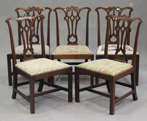 A set of five George III Chippendale period mahogany pierced splat back dining chairs with drop-in