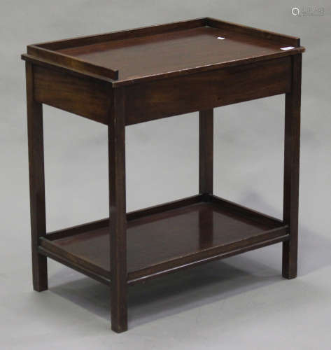 A 20th century mahogany side table, the galleried top above an end drawer, on block legs united by