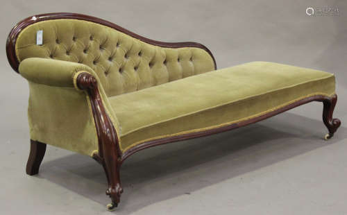 A Victorian mahogany showframe settee, upholstered in green velour and raised on carved cabriole