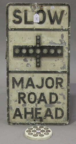 A cast metal 'Slow, Major Road Ahead' sign, inset with reflectors, 70cm x 36cm, together with a