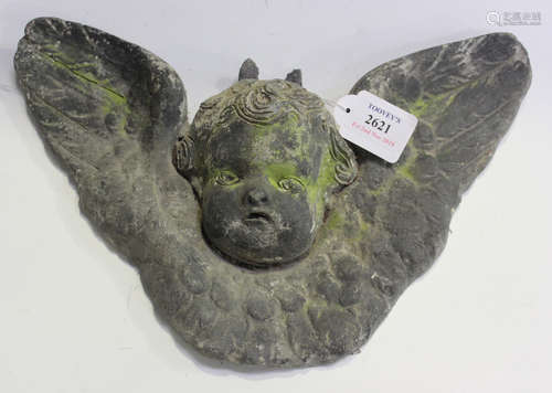 An early 20th century lead garden wall plaque of winged cherub mask form, width 34cm.Buyer’s Premium