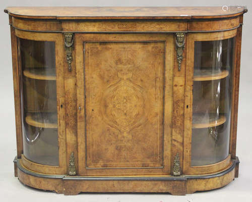 A Victorian burr walnut credenza with overall gilt metal mounts, raised on a shaped plinth base,