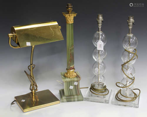 A pair of modern clear glass table lamps, height 45cm, together with a 20th century onyx and gilt