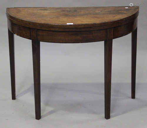 A George III mahogany demi-lune fold-over tea table, on square tapering legs, height 71cm, width