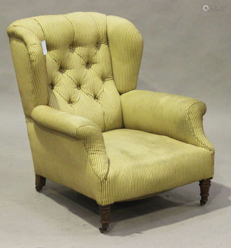 A Victorian wing back club armchair, on turned legs, height 91cm, width 81cm.Buyer’s Premium 29.