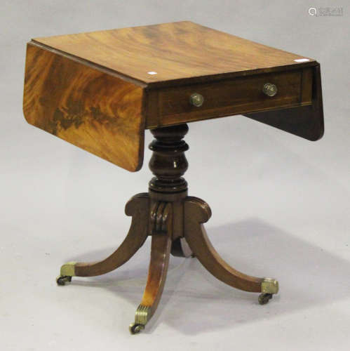 A George III mahogany sofa table, fitted with a frieze drawer, raised on a turned column and