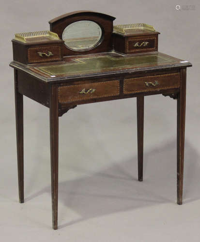 An Edwardian mahogany and chequer inlaid lady's writing table, fitted with a mirrored gallery and