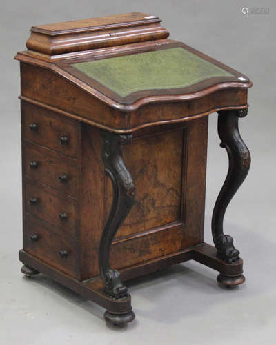 A Victorian walnut Davenport desk, fitted with a pen compartment and a hinged writing surface