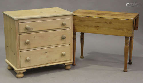 A 20th century Victorian style pine chest of three drawers, on turned bun feet, height 79cm, width