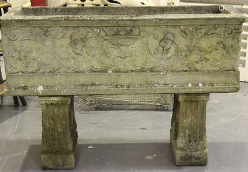 A 20th century cast composition stone garden planter of rectangular form, cast in relief with fruit,