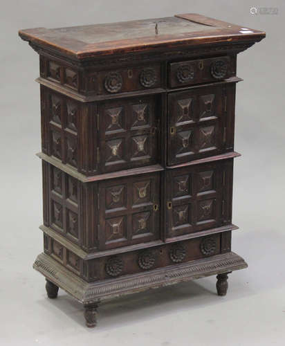 A 19th century and later Continental walnut side cabinet with carved decoration, fitted with two