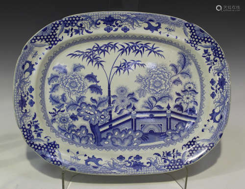 A Davenport Stone China Bamboo and Peony pattern blue printed platter with gravy well, circa 1825-