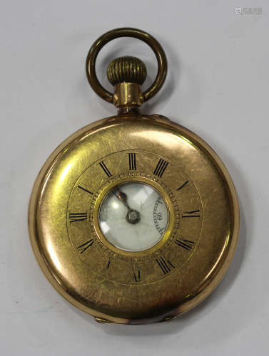 A gold half-hunting cased keyless wind gentleman's pocket watch with an unsigned lever movement