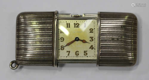 A Movado silver cased rectangular travelling purse watch, the square dial with Arabic numerals,