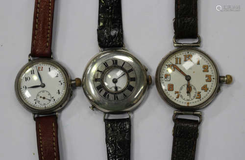 A silver circular cased wristwatch with a screw-down movement, import mark Glasgow 1915, another