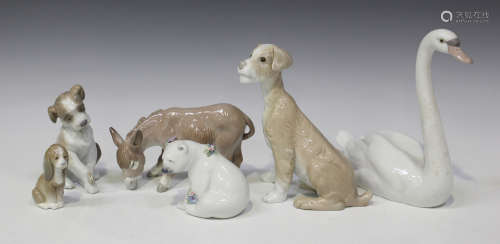 A collection of ten Lladro porcelain models of animals, including Polar Bear seated with flowers,