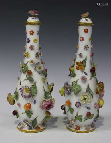 A pair of Meissen porcelain bottle vases and covers, late 19th century, of slender pear shape,