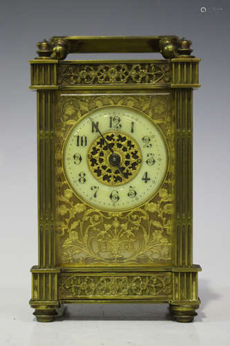 An early 20th century French brass carriage timepiece with eight day movement, the cream chapter