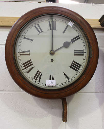 An early 20th century mahogany circular cased wall timepiece with single fusee movement, the