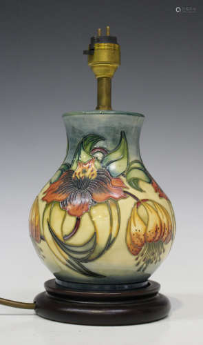 A Moorcroft pottery table lampbase, the baluster body decorated with Anna Lily design, total