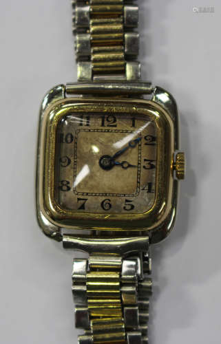An 18ct two-colour gold square cased lady's wristwatch with an unsigned jewelled lever movement, the