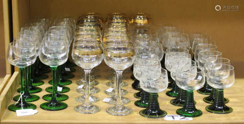 A collection of 20th century glassware, including a set of fourteen green stemmed hock glasses,