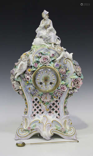 A Continental porcelain cased mantel clock, late 19th century, with eight day movement striking on a