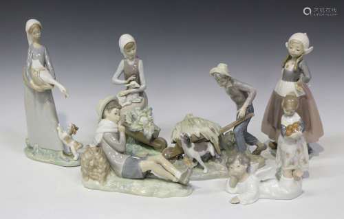A collection of fourteen Lladro porcelain figures, including Gretel, No. 5064, Bird Watcher, No.