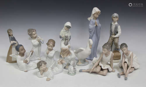 A group of four assorted Lladro angel figures, together with a Lladro girl holding a pig, a Lladro