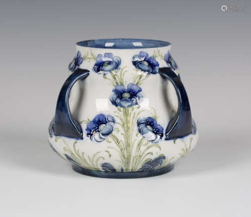 A Macintyre & Co Moorcroft Florian Ware four handled vase, circa 1904, the baluster body decorated
