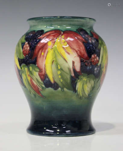 A Moorcroft pottery vase, circa 1928-35, the baluster body decorated with blackberry and leaf design