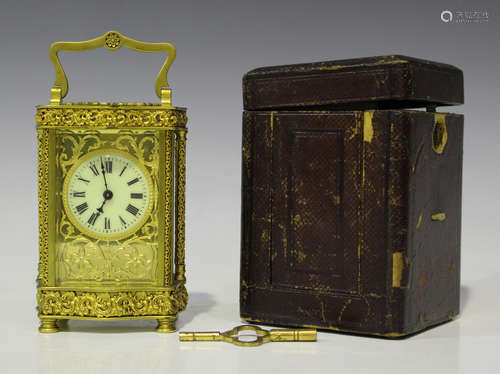 A late 19th/early 20th century French gilt brass carriage timepiece, the cream circular dial with