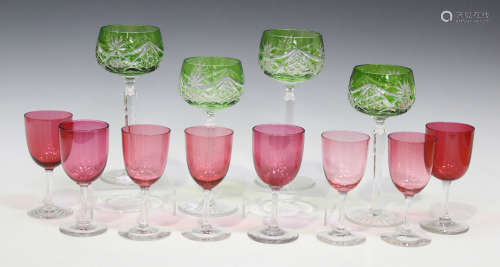A set of four Bohemian green flash overlay hock glasses, 20th century, each with star and facet
