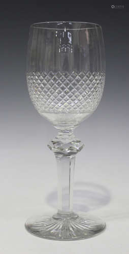 A Waterford style oversize wine glass, the rounded bowl cut with a diamond pattern to the lower