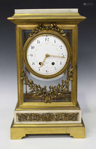 A late 19th century French ormolu and white marble four glass mantel clock with eight day movement