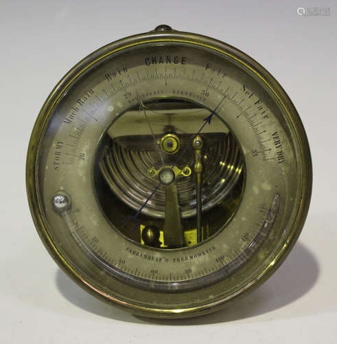 A late 19th century brass cased holosteric barometer, the silvered dial fitted with a Fahrenheits