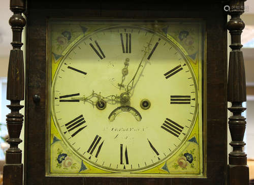 An early 19th century oak longcase clock with eight day movement striking on a bell, the painted